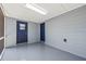 Covered patio featuring two doors and gray painted walls at 2305 N 48Th St, Tampa, FL 33605