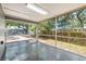 Enclosed screened porch with a view of the backyard at 2305 N 48Th St, Tampa, FL 33605