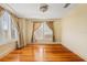 Cozy bedroom with hardwood floors and neutral-colored walls at 2450 2Nd N Ave, St Petersburg, FL 33713