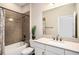 Full bathroom features a shower-tub combo with stylish tile surround and granite vanity at 2515 63Rd Ter E, Ellenton, FL 34222