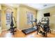Well-equipped exercise room featuring modern fitness equipment, natural light, and a comfortable workout space at 2515 63Rd Ter E, Ellenton, FL 34222