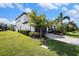 Two-story home showcasing well-maintained landscaping, a paver driveway, and an attached garage at 2515 63Rd Ter E, Ellenton, FL 34222
