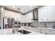 Beautiful kitchen features white cabinetry, stainless steel appliances, and modern countertops at 2515 63Rd Ter E, Ellenton, FL 34222