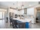Bright kitchen with island, stainless steel appliances, and modern gray countertops at 2515 63Rd Ter E, Ellenton, FL 34222