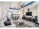 Open-concept living room and dining area with wood flooring, modern furniture, and stylish decor at 2515 63Rd Ter E, Ellenton, FL 34222