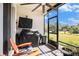 Relaxing screened patio with ceiling fan, outdoor seating, and a grill, perfect for entertaining at 2515 63Rd Ter E, Ellenton, FL 34222