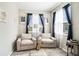 Sitting room area with beige armchairs and natural light from the window at 2515 63Rd Ter E, Ellenton, FL 34222
