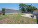 Fenced in backyard features a storage shed with grass yard at 2614 E Liberty St, Tampa, FL 33612
