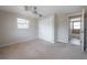 Bright bedroom featuring carpeted floors, ceiling fan, and closet at 2614 E Liberty St, Tampa, FL 33612