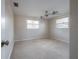 Comfortable bedroom with carpet, ceiling fan, and plenty of natural light from the windows at 2614 E Liberty St, Tampa, FL 33612