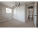 Bright bedroom featuring neutral walls, carpet floors, ceiling fan, and a closet with sliding doors at 2614 E Liberty St, Tampa, FL 33612