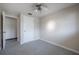 Bedroom featuring neutral walls, carpeted floors, a ceiling fan, and closet at 2614 E Liberty St, Tampa, FL 33612