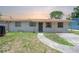 Simple single-story home featuring basic architecture and minimal landscaping at 2614 E Liberty St, Tampa, FL 33612
