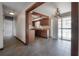 Open kitchen with wood cabinets and a chandelier over the dining area at 2614 E Liberty St, Tampa, FL 33612