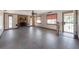 Open living room showcasing tile flooring, fireplace, and ample space at 2614 E Liberty St, Tampa, FL 33612