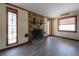 Bright living room with a stone fireplace and large windows at 2614 E Liberty St, Tampa, FL 33612