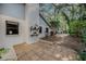 Cozy backyard patio with a white chimney and lush landscaping at 2838 Timber Knoll Dr, Valrico, FL 33596