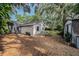 Spacious backyard with storage building and mature trees at 2838 Timber Knoll Dr, Valrico, FL 33596