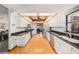 Bright kitchen featuring white cabinets, granite countertops, and stainless steel appliances at 2838 Timber Knoll Dr, Valrico, FL 33596