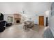 Bright living room with a cozy brick fireplace and wood laminate floors at 2838 Timber Knoll Dr, Valrico, FL 33596