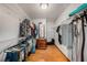 Spacious walk-in closet with wooden floors, multiple hanging racks, and a dresser with mirror at 2838 Timber Knoll Dr, Valrico, FL 33596