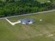 Aerial view of the home showcasing its large lot and rear brick patio at 30017 Johnston Rd, Dade City, FL 33523