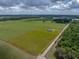 Spacious land parcel showcasing a lovely home nestled among green fields and natural landscapes at 30017 Johnston Rd, Dade City, FL 33523