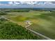 Expansive property with a well-maintained home and large green fields, perfect for serene country living at 30017 Johnston Rd, Dade City, FL 33523