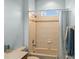 Shower-tub combination featuring beige tile and a window at 30017 Johnston Rd, Dade City, FL 33523