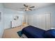 Cozy bedroom with a ceiling fan, a large closet, and a dresser with a mirror at 30017 Johnston Rd, Dade City, FL 33523