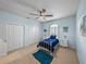 Comfortable bedroom featuring a ceiling fan, white trim, and modern accents at 30017 Johnston Rd, Dade City, FL 33523
