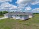 Well-maintained home showcasing a pristine lawn and thoughtful landscaping at 30017 Johnston Rd, Dade City, FL 33523