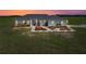 Charming single-story home featuring manicured landscaping and a well-maintained lawn at sunset at 30017 Johnston Rd, Dade City, FL 33523