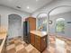 Kitchen with stainless steel refrigerator, tiled floors, and a dining area at 30017 Johnston Rd, Dade City, FL 33523
