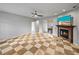 Bright living room features unique checkered tile, a fireplace, and sliding doors to the dining area at 30017 Johnston Rd, Dade City, FL 33523