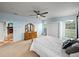 Bedroom with access to Primary bath and fireplace, carpet floors, and bright lighting at 30017 Johnston Rd, Dade City, FL 33523