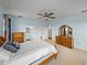 Bedroom with carpet floors, ensuite bathroom, and plenty of natural lighting at 30017 Johnston Rd, Dade City, FL 33523