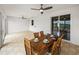 Inviting patio area with tile flooring, wooden table and chairs, and picturesque landscape views at 30017 Johnston Rd, Dade City, FL 33523
