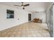Bright sunroom with ceiling fans, tile floor, dining table and sliding glass doors at 30017 Johnston Rd, Dade City, FL 33523