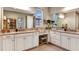 Bathroom with dual sinks, granite counters and ample cabinet space at 34053 Anchor Light Ln, Wesley Chapel, FL 33543