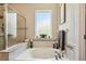 Relaxing bathroom featuring a jacuzzi tub and a tiled shower with a glass door at 3530 Brook Crossing Dr, Brandon, FL 33511