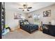 Bright bedroom with playful decor, a guitar, and a cozy bed, perfect for a or teenager at 3530 Brook Crossing Dr, Brandon, FL 33511