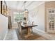Traditional dining room featuring a wooden table and upholstered chairs and natural light from a window at 3530 Brook Crossing Dr, Brandon, FL 33511