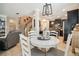 Open-concept kitchen with dark cabinets, a breakfast nook, and easy access to the living room at 3530 Brook Crossing Dr, Brandon, FL 33511