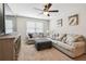 Comfortable living room with soft carpet, neutral colored sofas and loveseats for relaxing with Gathering at 3530 Brook Crossing Dr, Brandon, FL 33511