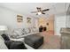 Relaxing living room with large cushioned sofa and loveseat, soft neutral carpet, and plenty of room at 3530 Brook Crossing Dr, Brandon, FL 33511