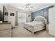 Serene main bedroom with a panel accent wall, a ceiling fan, and plenty of natural light at 3530 Brook Crossing Dr, Brandon, FL 33511
