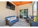 Cozy screened patio with comfortable seating, a ceiling fan, and TV for entertaining outdoors at 3530 Brook Crossing Dr, Brandon, FL 33511