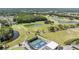 View of the community featuring a golf course, water features, and tennis courts at 3839 Trophy Blvd # 3839, New Port Richey, FL 34655