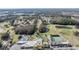 Community clubhouse featuring swimming pools, and tennis courts surrounded by green landscape at 3839 Trophy Blvd # 3839, New Port Richey, FL 34655